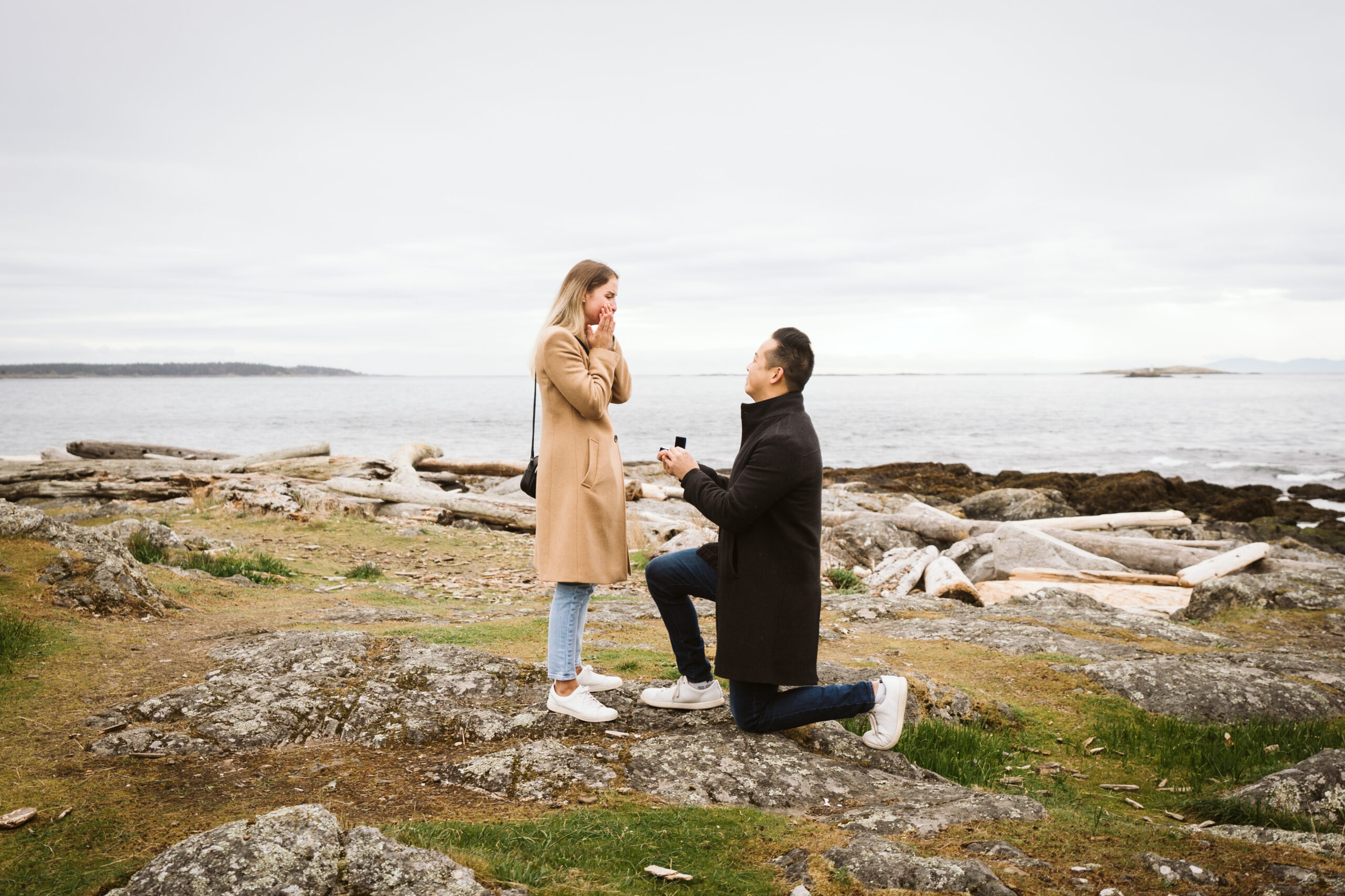 Man proposing to his girlfriend at Cattle Point on Vancouver Island